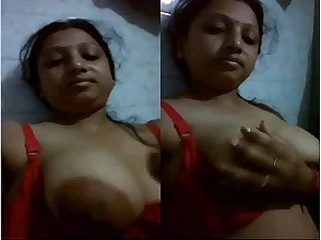 Small bosomed Erect beauty Minaz plays with her tits on camera.